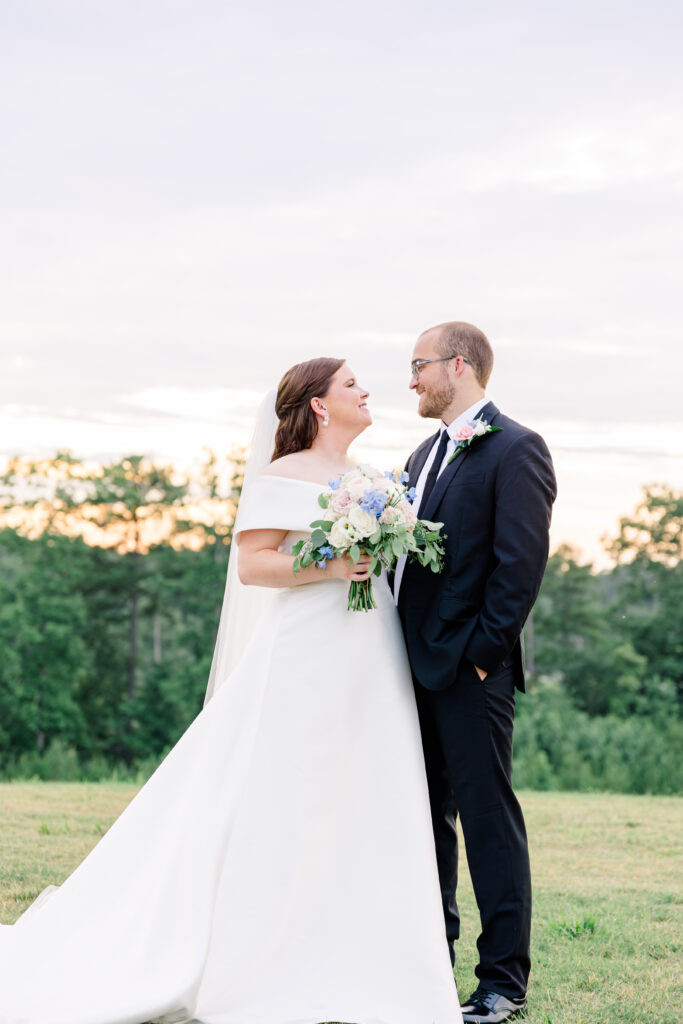 Couple looking lovingly at each other during golden hour at a Tuscaloosa wedding.