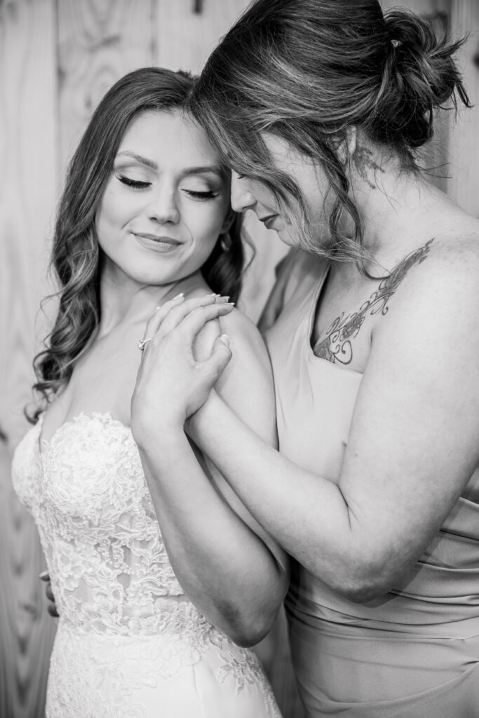 Bride and mother sharing a tearful moment.