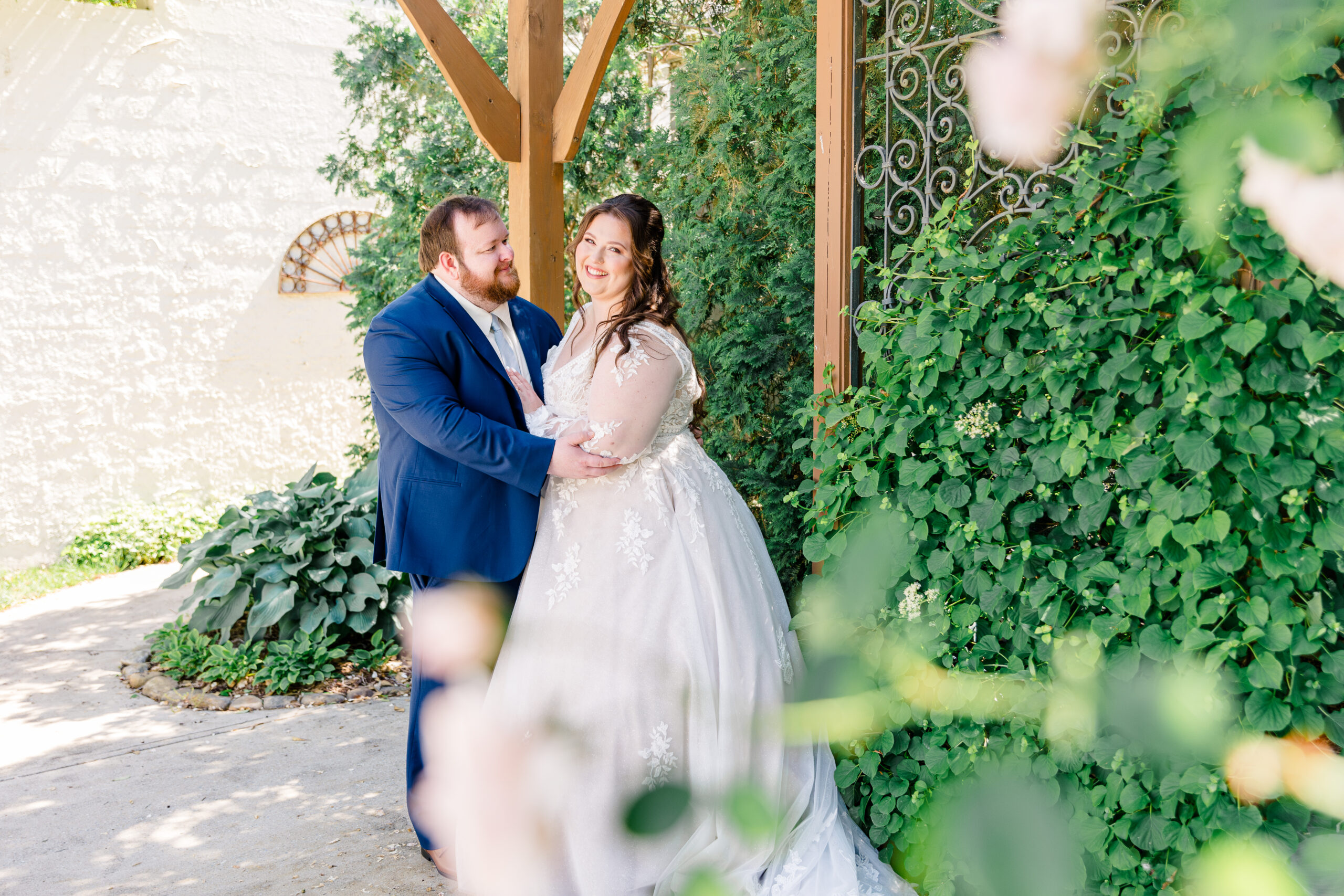 Bride and groom sharing a heartfelt moment during portraits on wedding day.