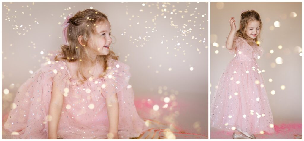 Little girl in a pink dress laughing and twirling as glitter falls down for a glitter photoshoot