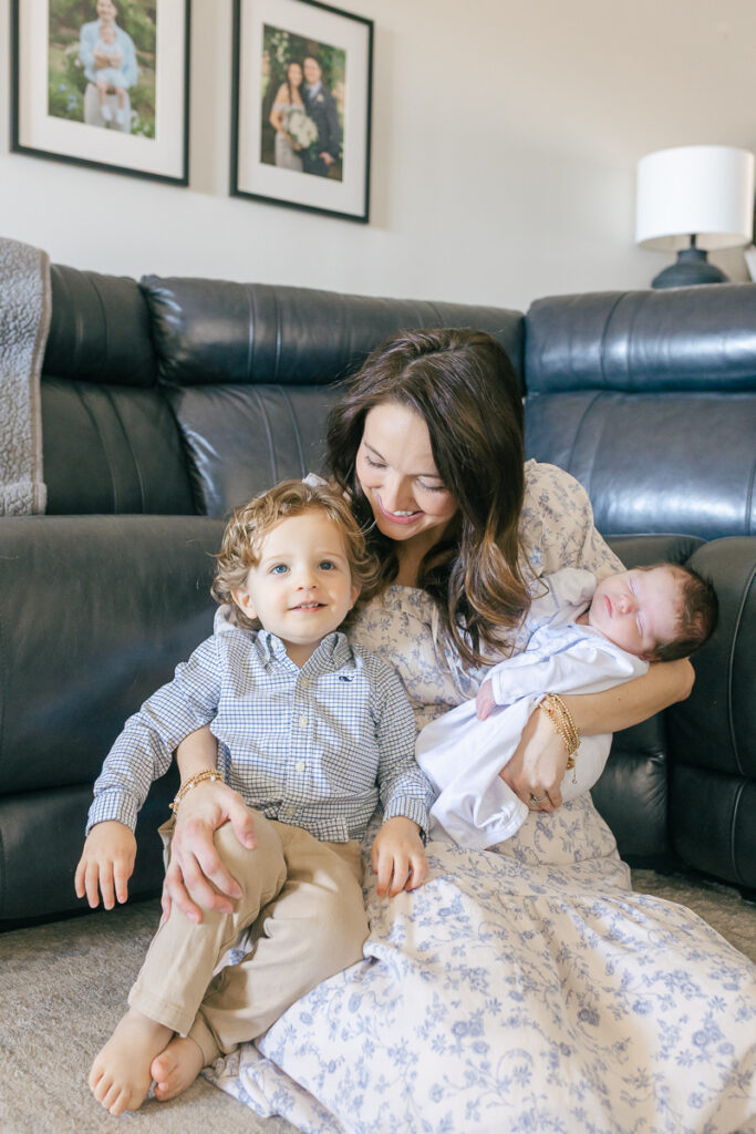 Mother sitting in front of a window with her two sons close, soft natural light, West Alabama family portrait